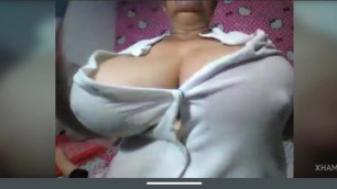 Granny with big nipples and massive tits shows ass in panties