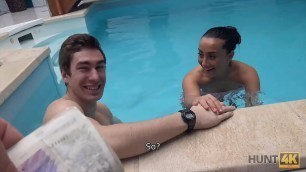 HUNT4K&period; Slim brunette has sex with stranger by the pool near her man